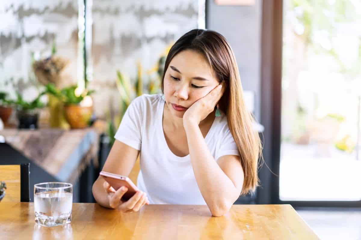 Young woman looking at phone