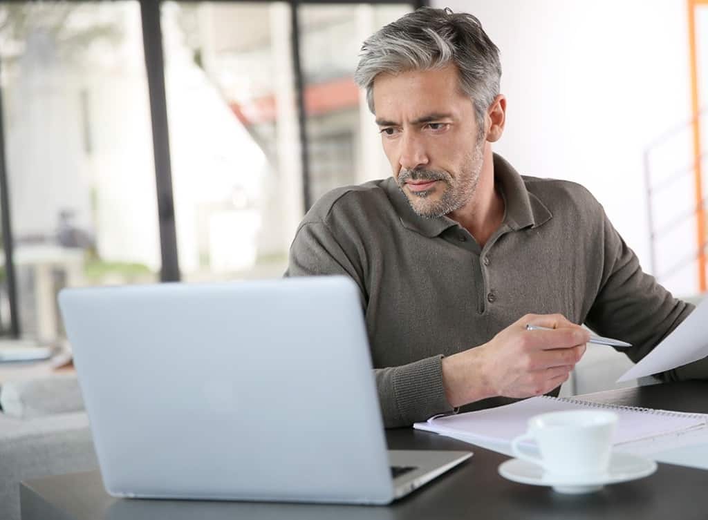 Man looking at computer screen