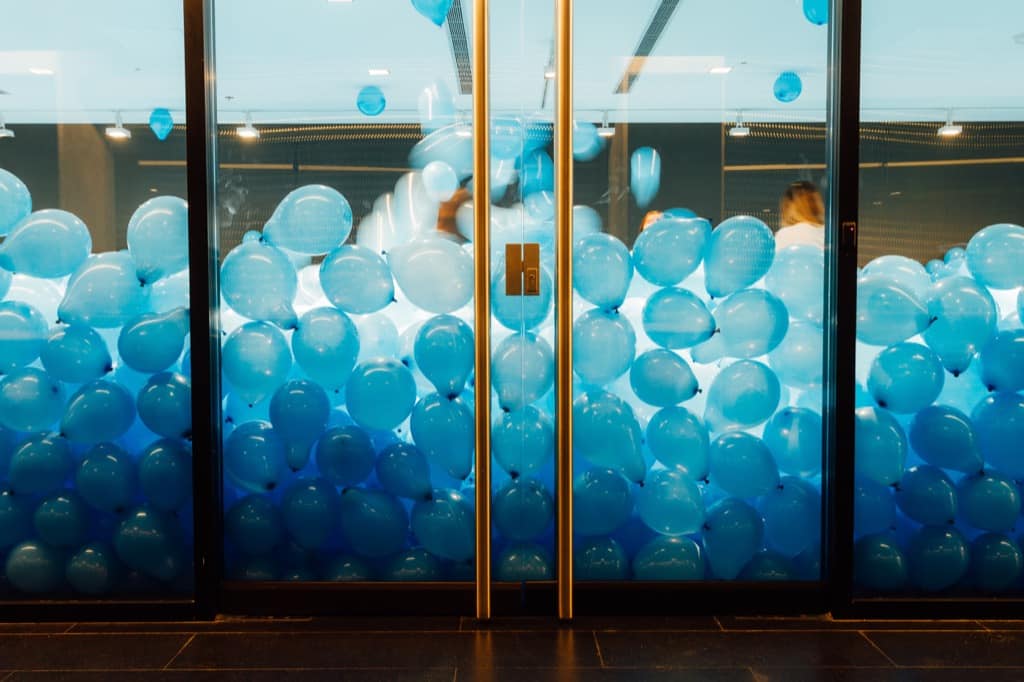 Room filled with blue ballooons
