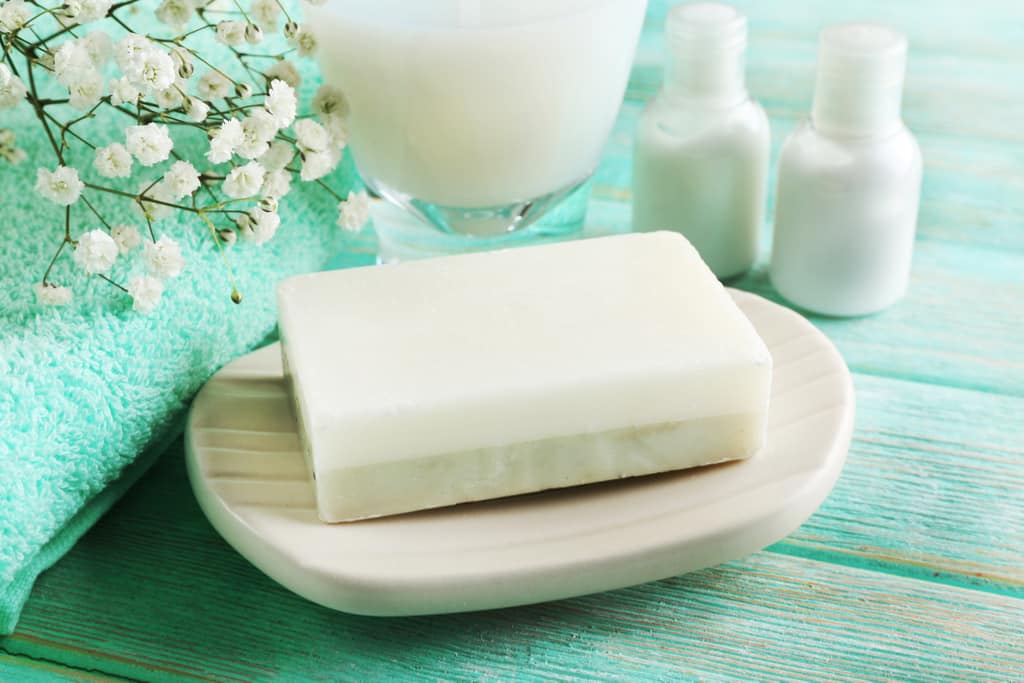 White bar of soap in soap dish